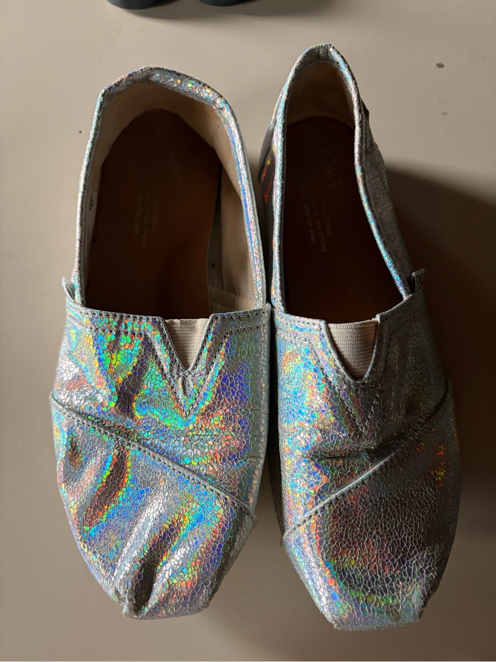 TOMS Alpargata slip-on flats in a silver iridescent or pearlized metallic canvas